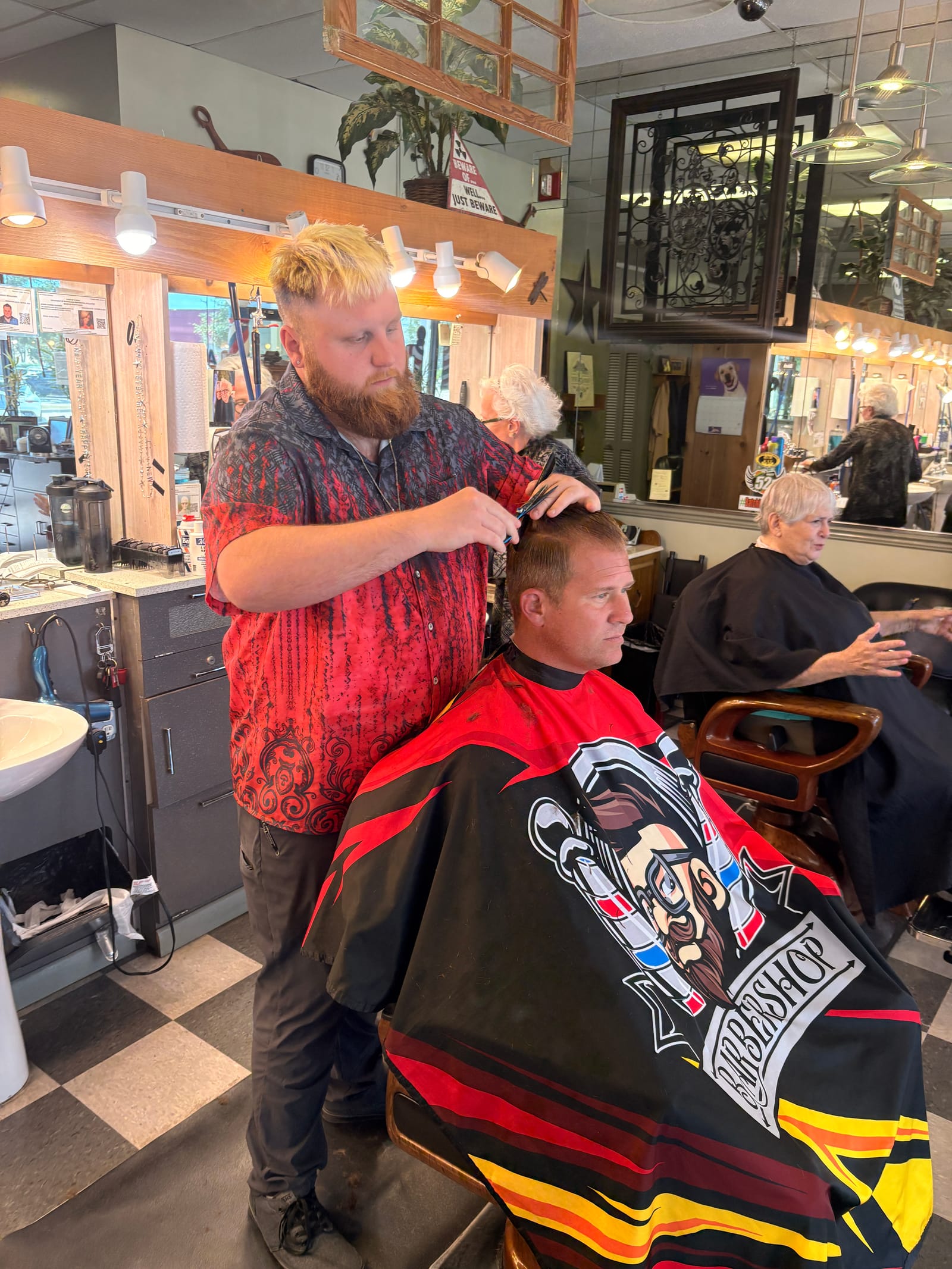 Kyle Wason at work — precision clipper work on a client