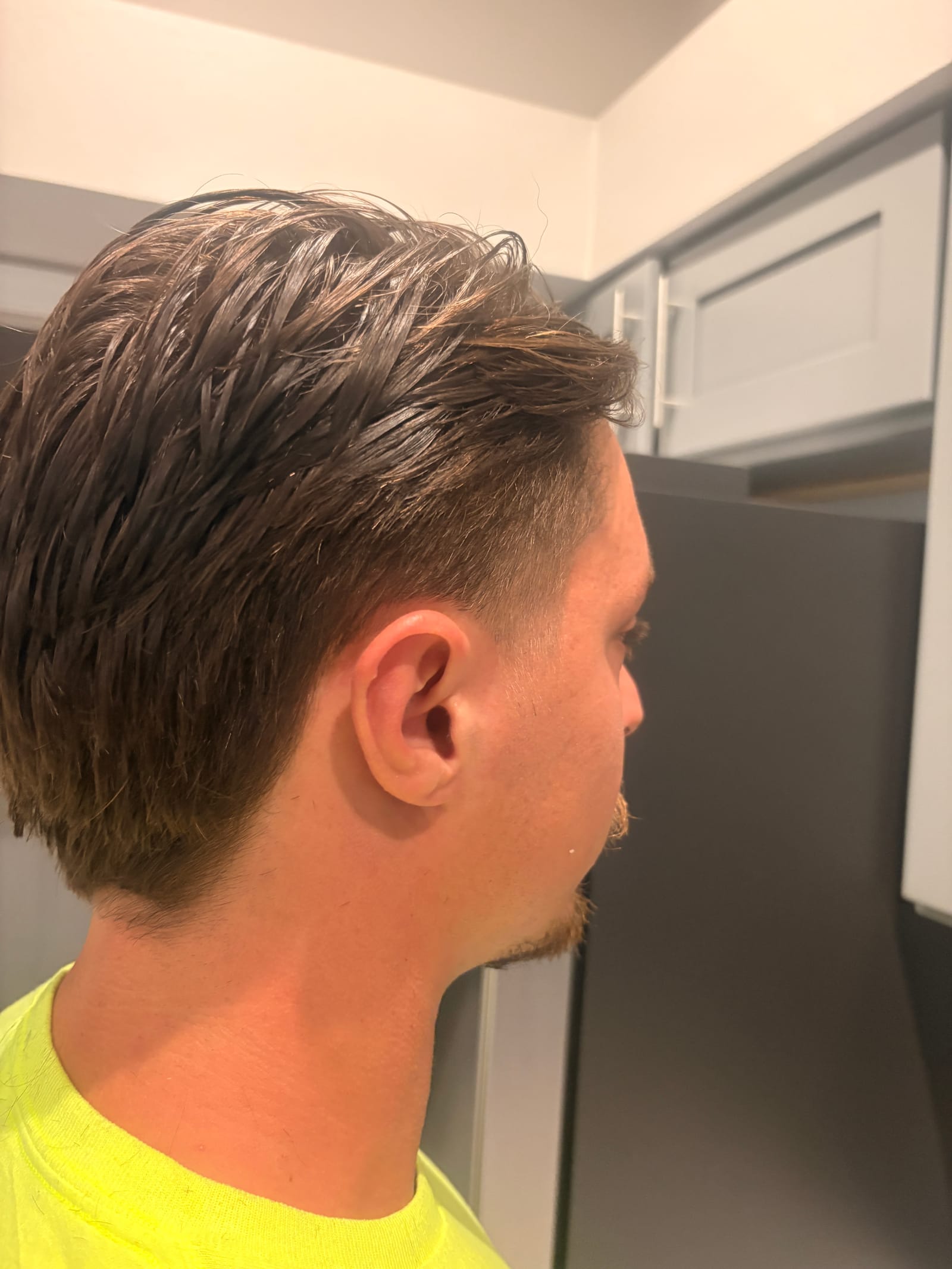 Slicked back style with low fade